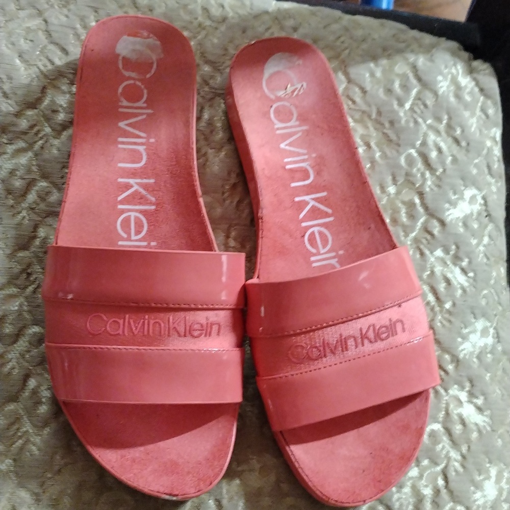Salmon color Calvin Klein sandals.